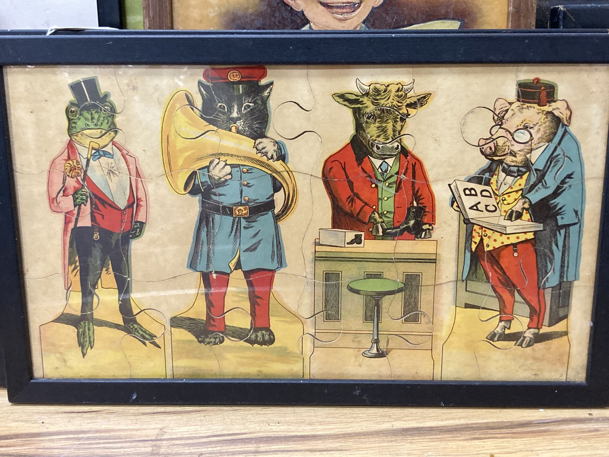 A group of Victorian and later chromolithographs and colour prints, including The tail-less donkey, 54 x 72cm and two jig-saw puzzles
